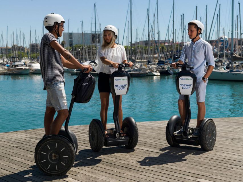 Three riders on segways along the harbour front in Barcelona